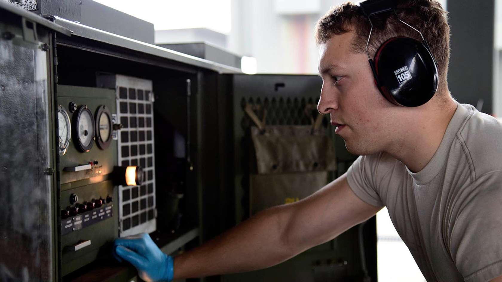 airmen working on equipment