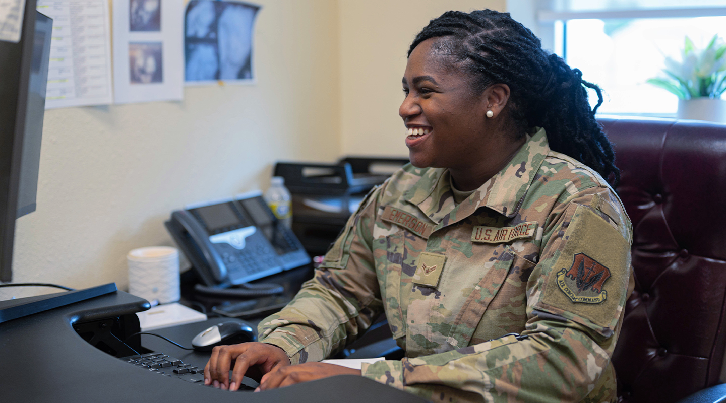 airman typing on keyboard