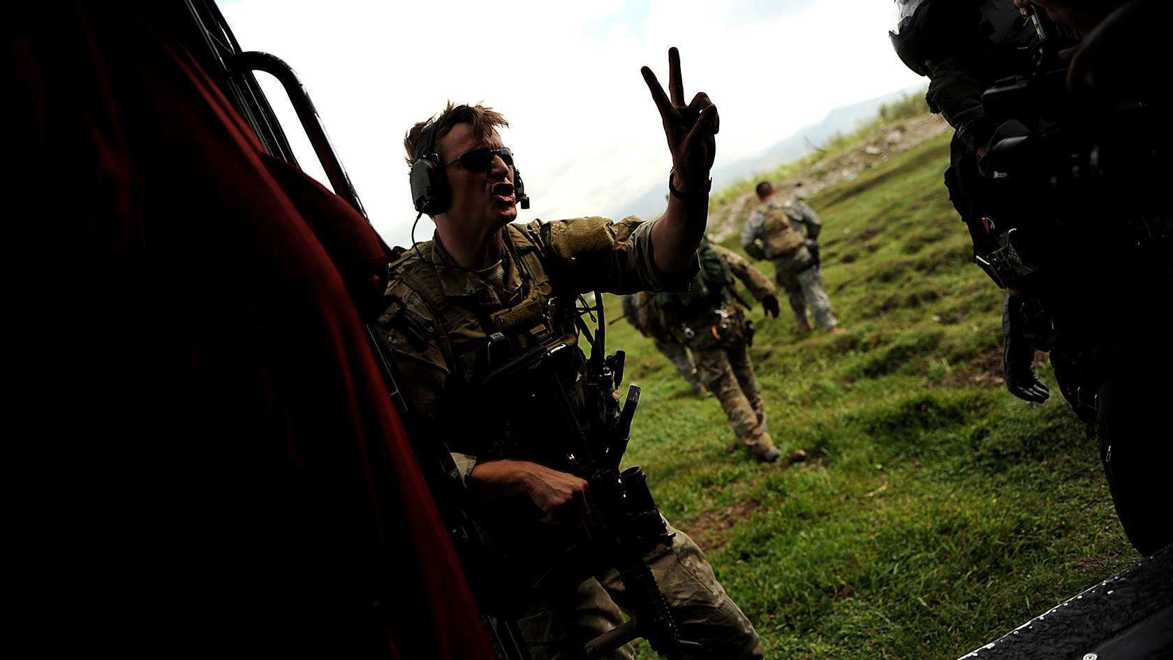 Air Force Combat Controller exiting helicopter