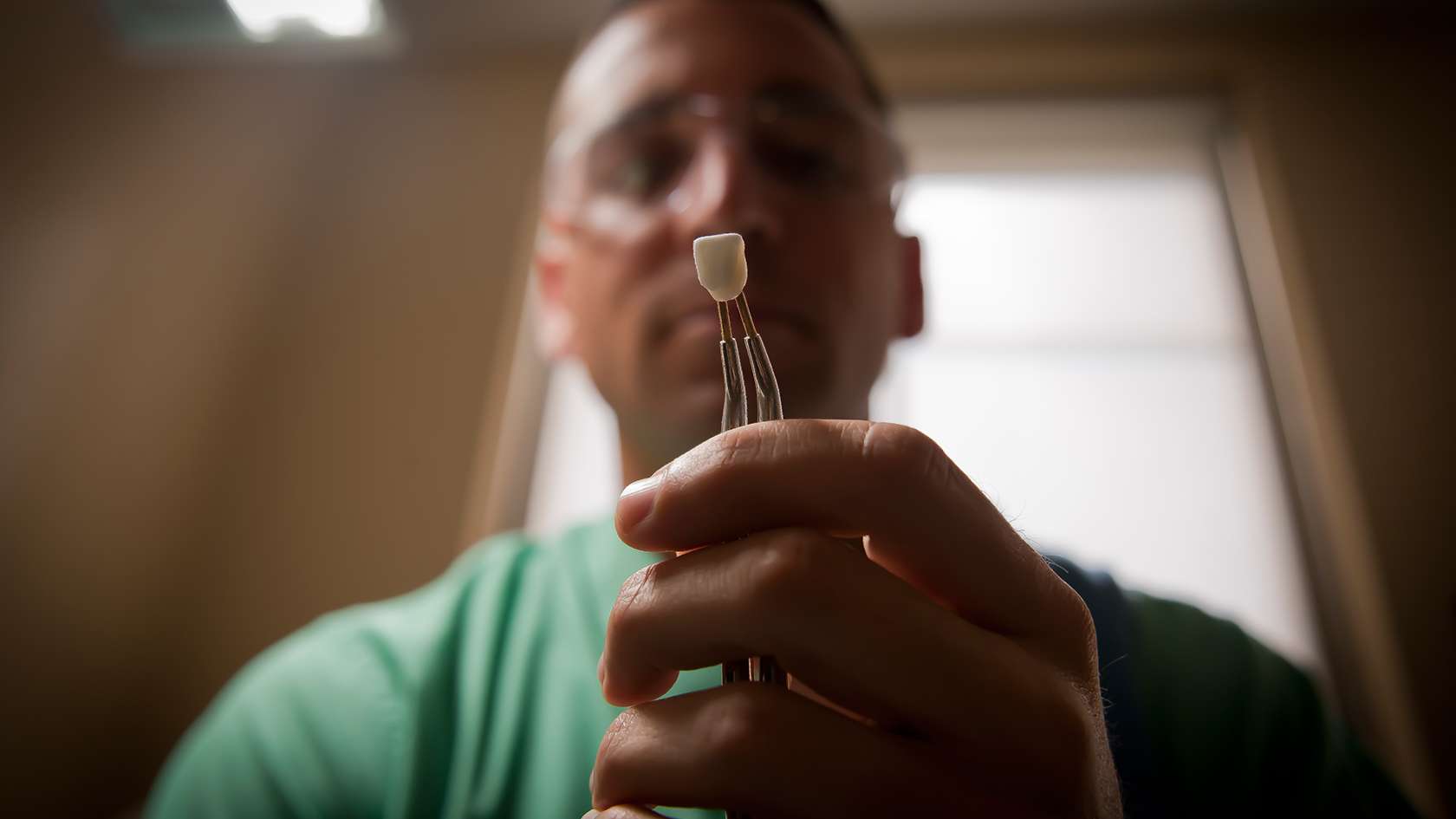 Dentist inspecting tooth