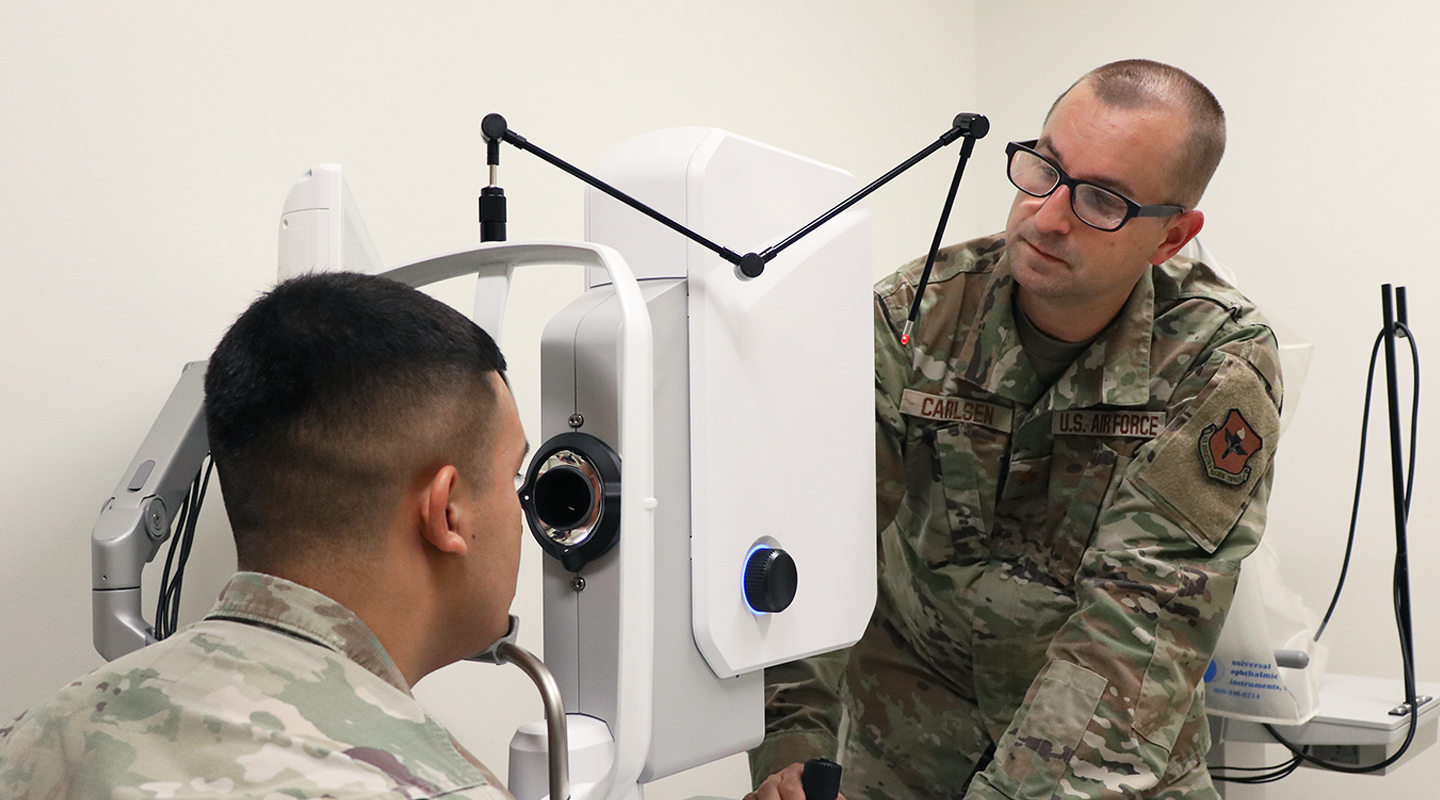 optometrist examining a patient