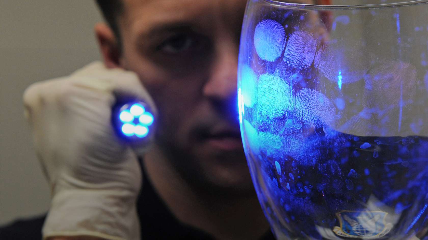 airman examining finger prints