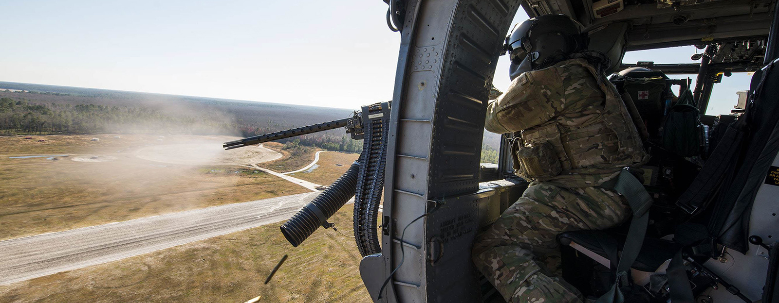 Special Missions Aviator firing artillery from helicopter