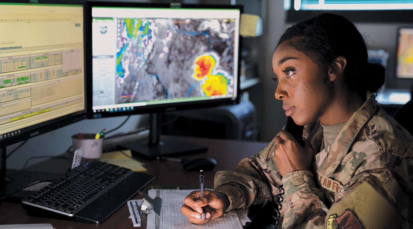 airman on phone taking notes