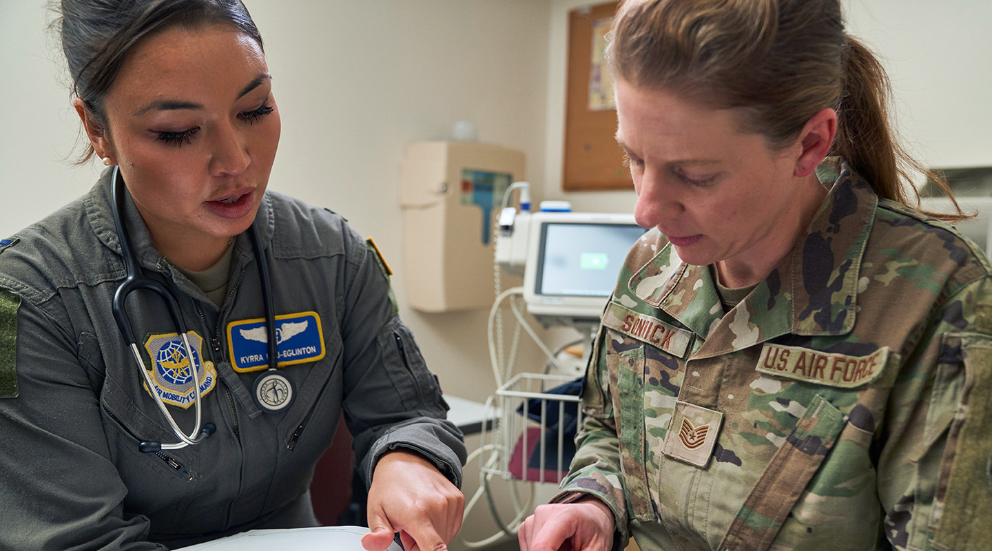 flight surgeon interacting with patietn