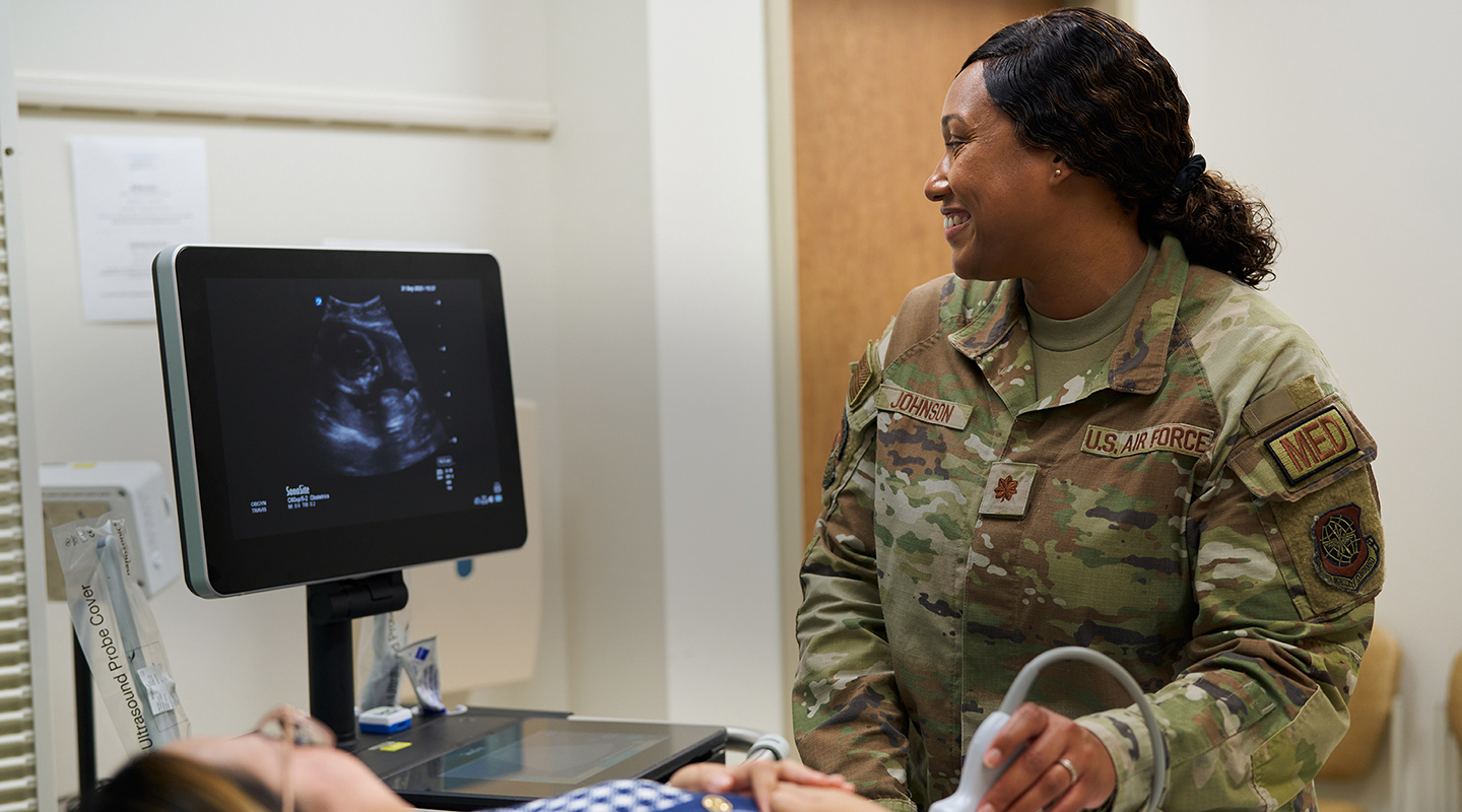 WOMEN'S HEALTHCARE NURSE PRACTITIONER conducting ultrasound