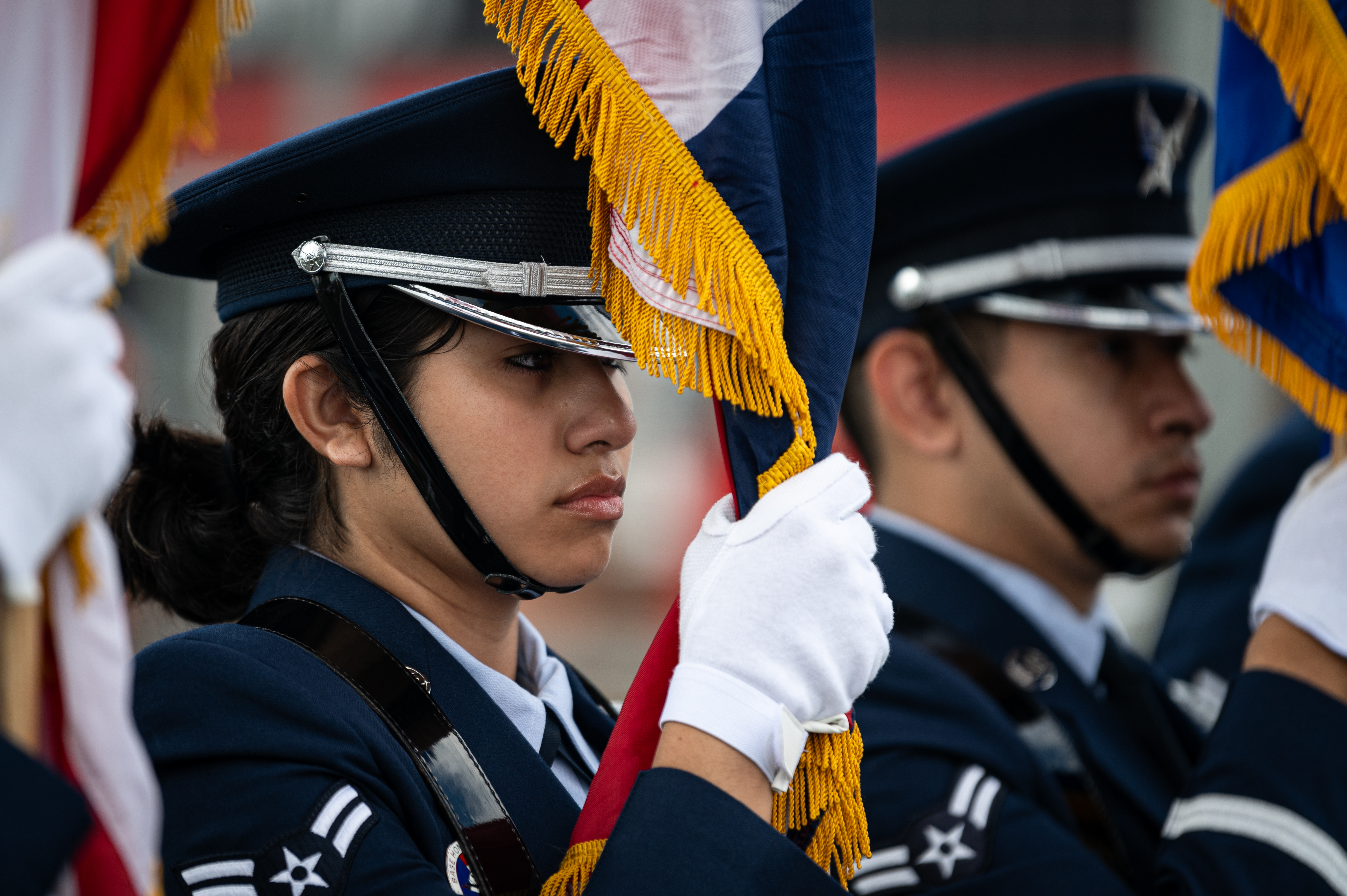 female honor guard as a flag bearer standing still