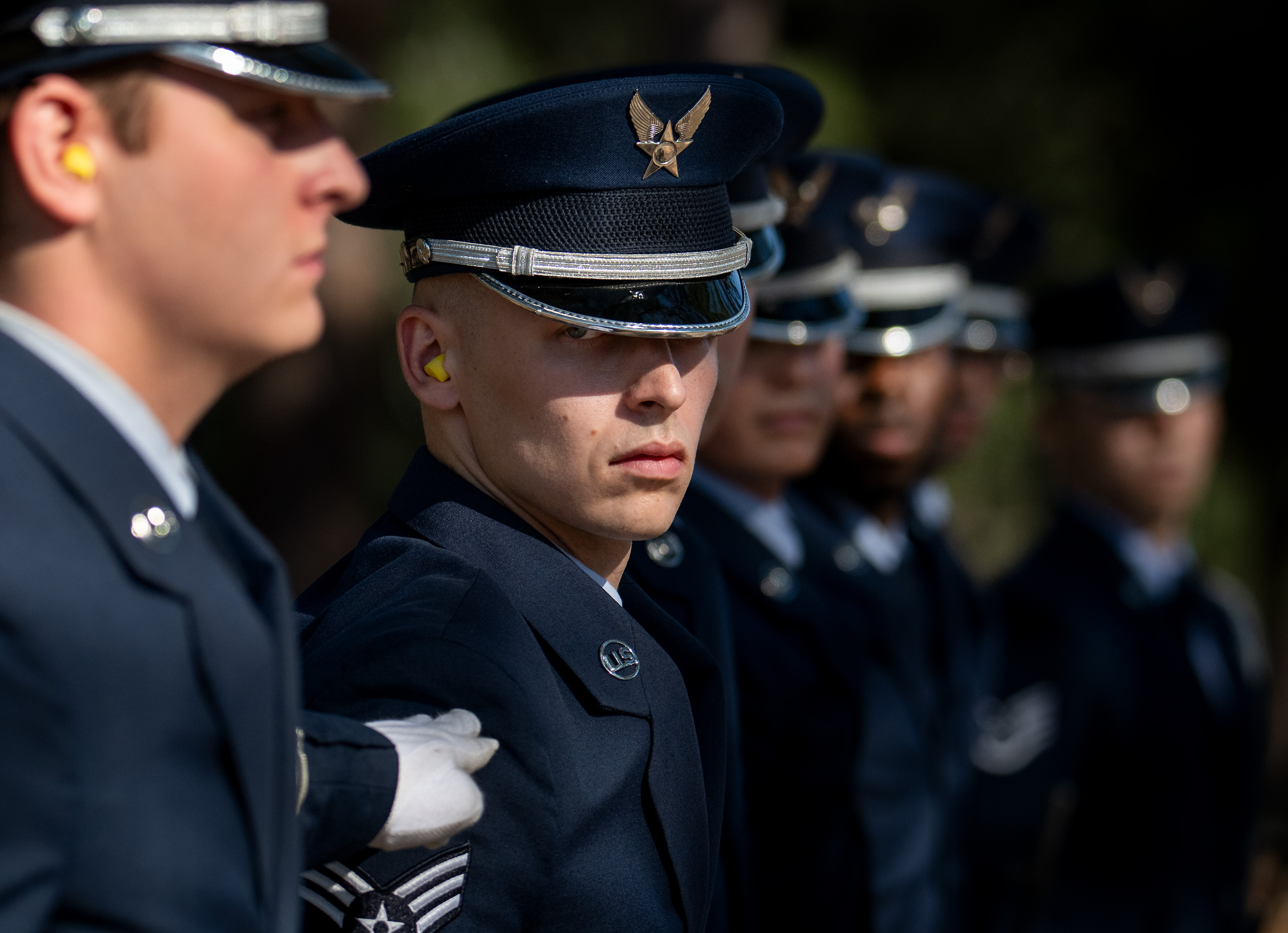 honor guard lined up with their heads facing the right.