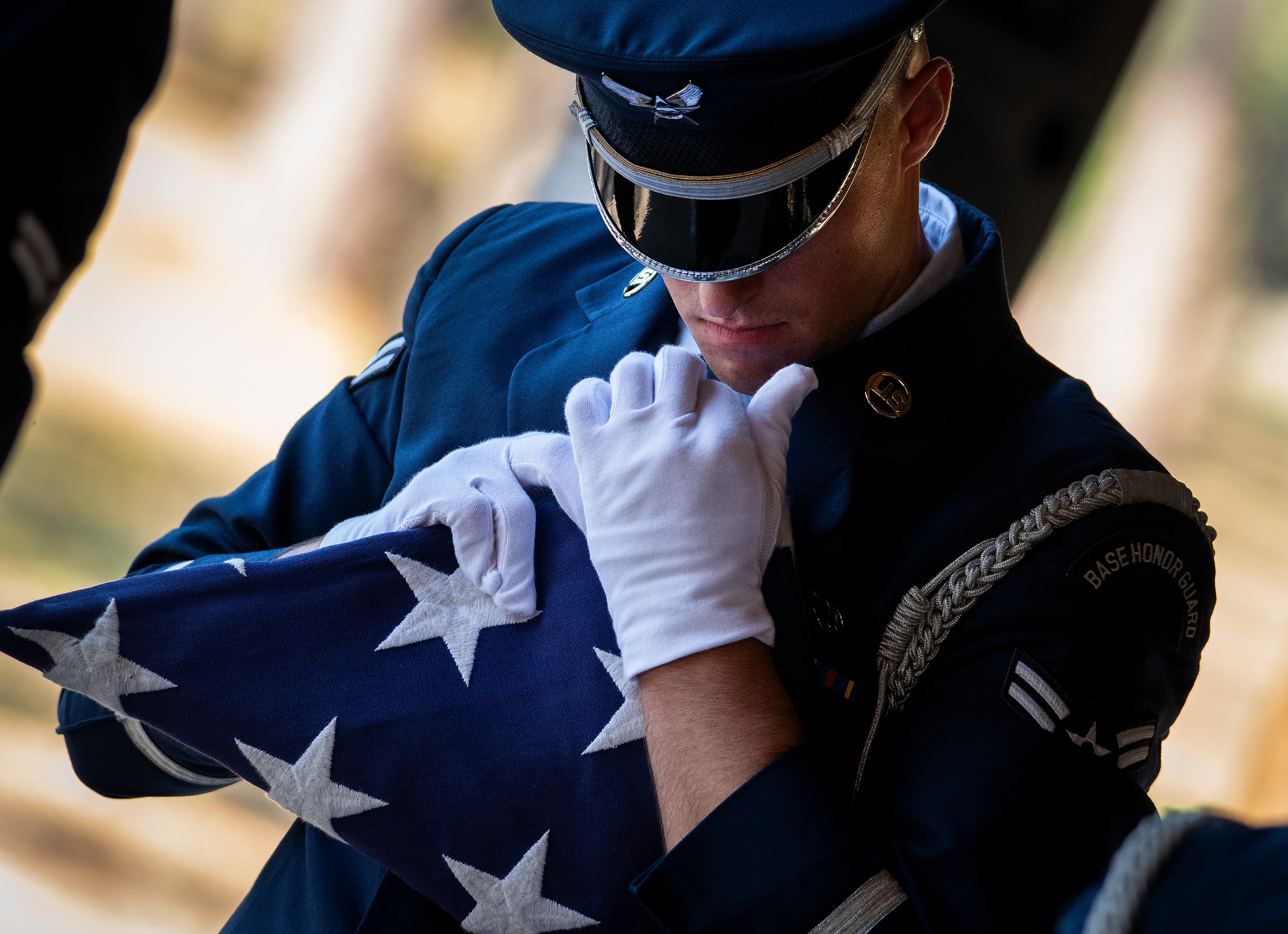 male honor guard folding the flag