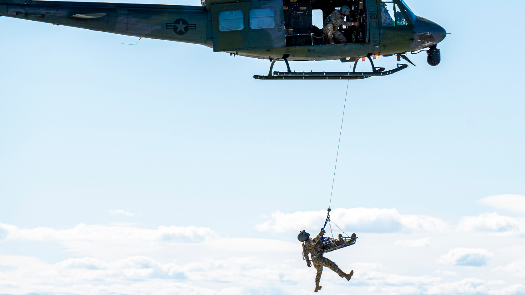 rescue airmen being pulled up