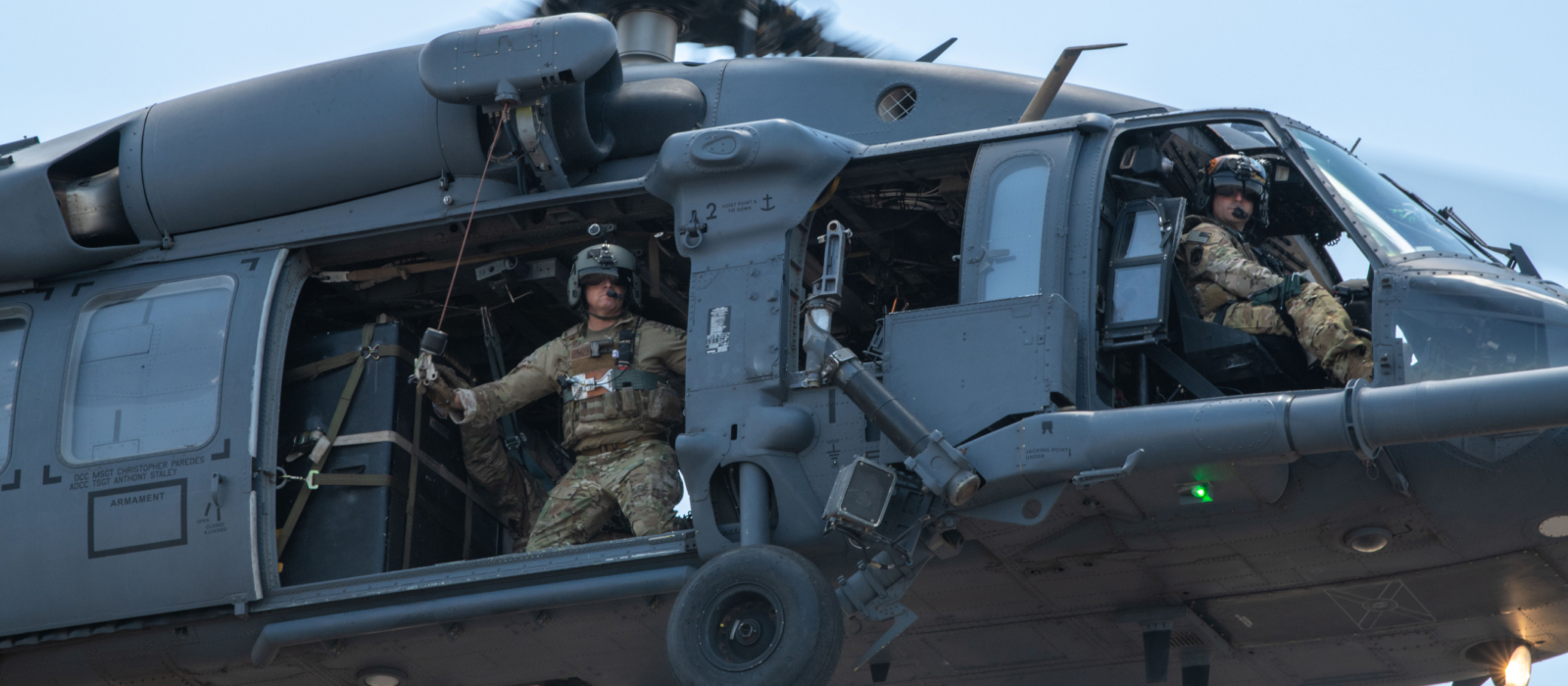 airmen in helicopter