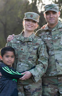 image of two married airmen with their child