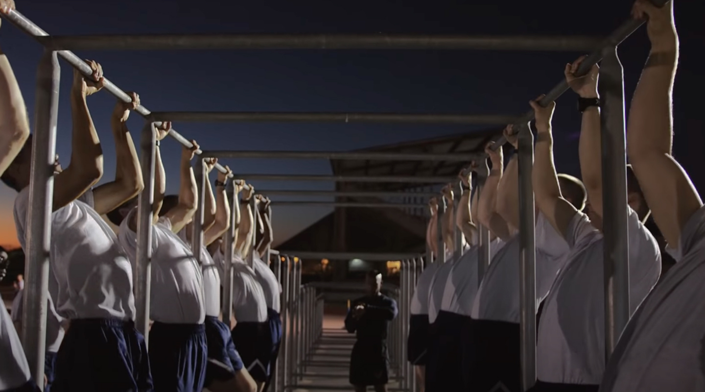 Trainees doing pull-ups in BMT Week 3