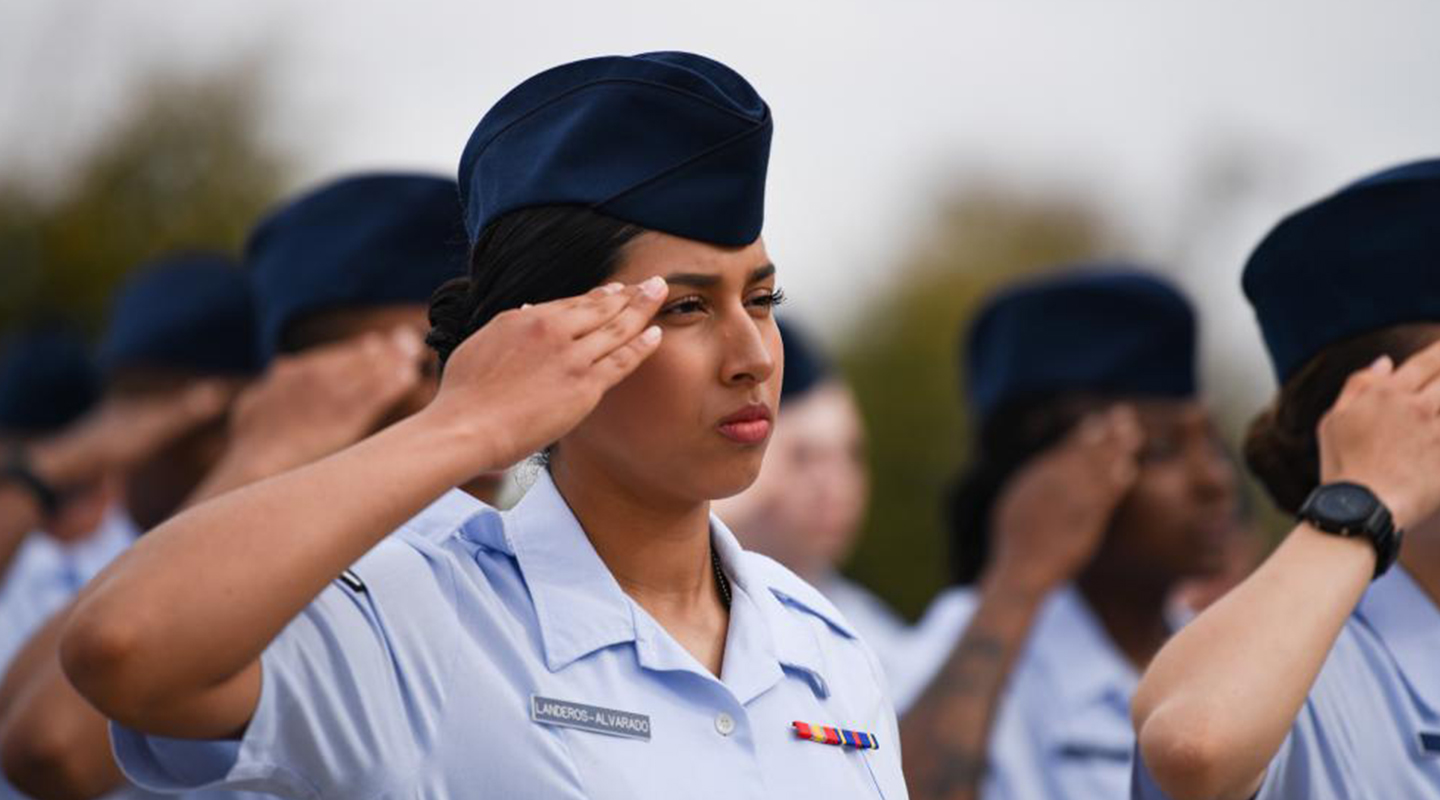 female airman saluting