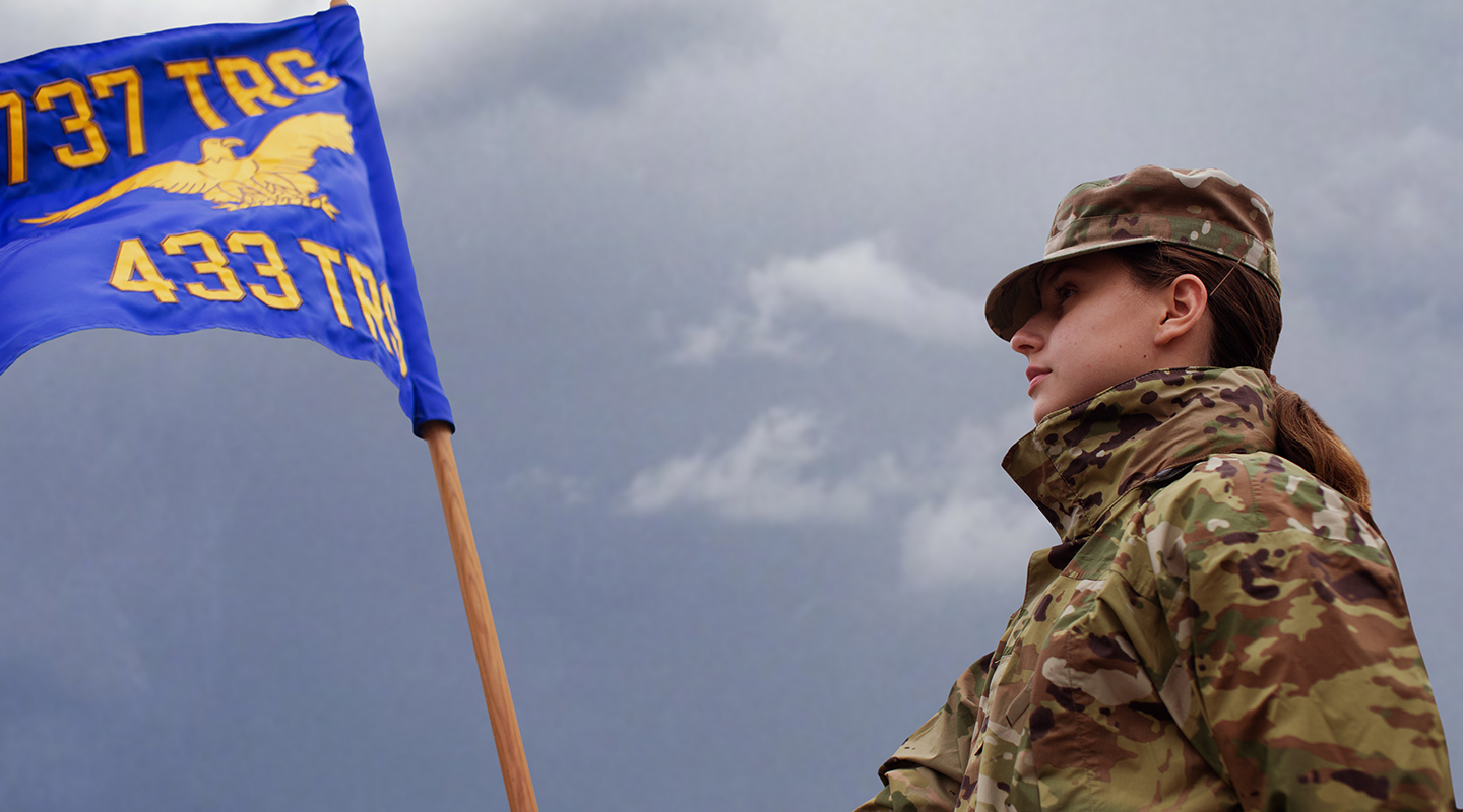 a trainee holding a flag