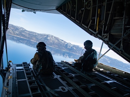 Airman sitting in aircraft hatch open