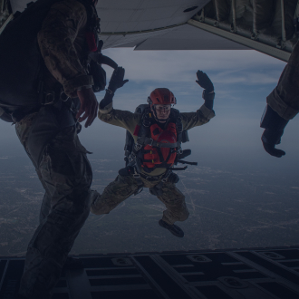 Pararescue Airmen jumping from plane