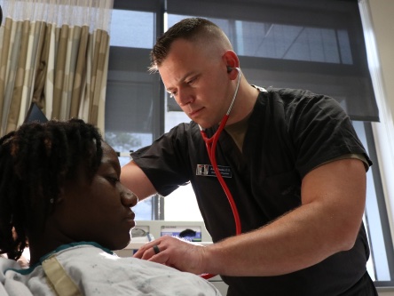 Man using stethoscope