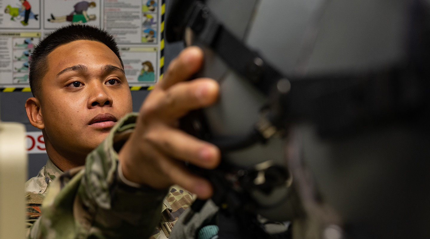 airman holding up equipment