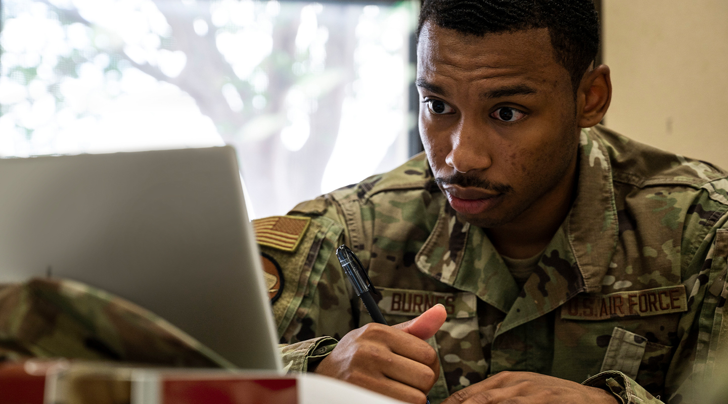 airman looking at laptop