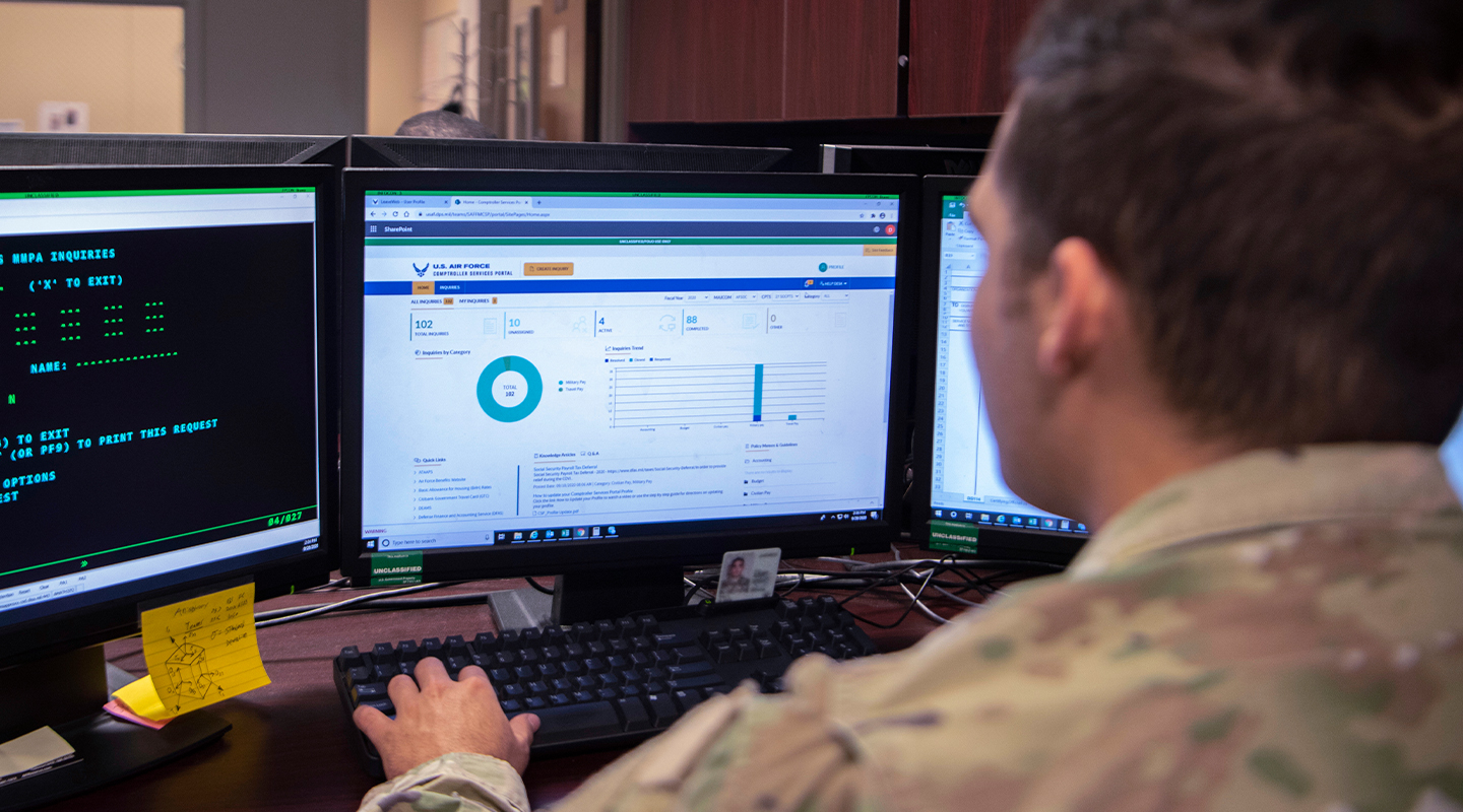 airman reviewing information on computer screen