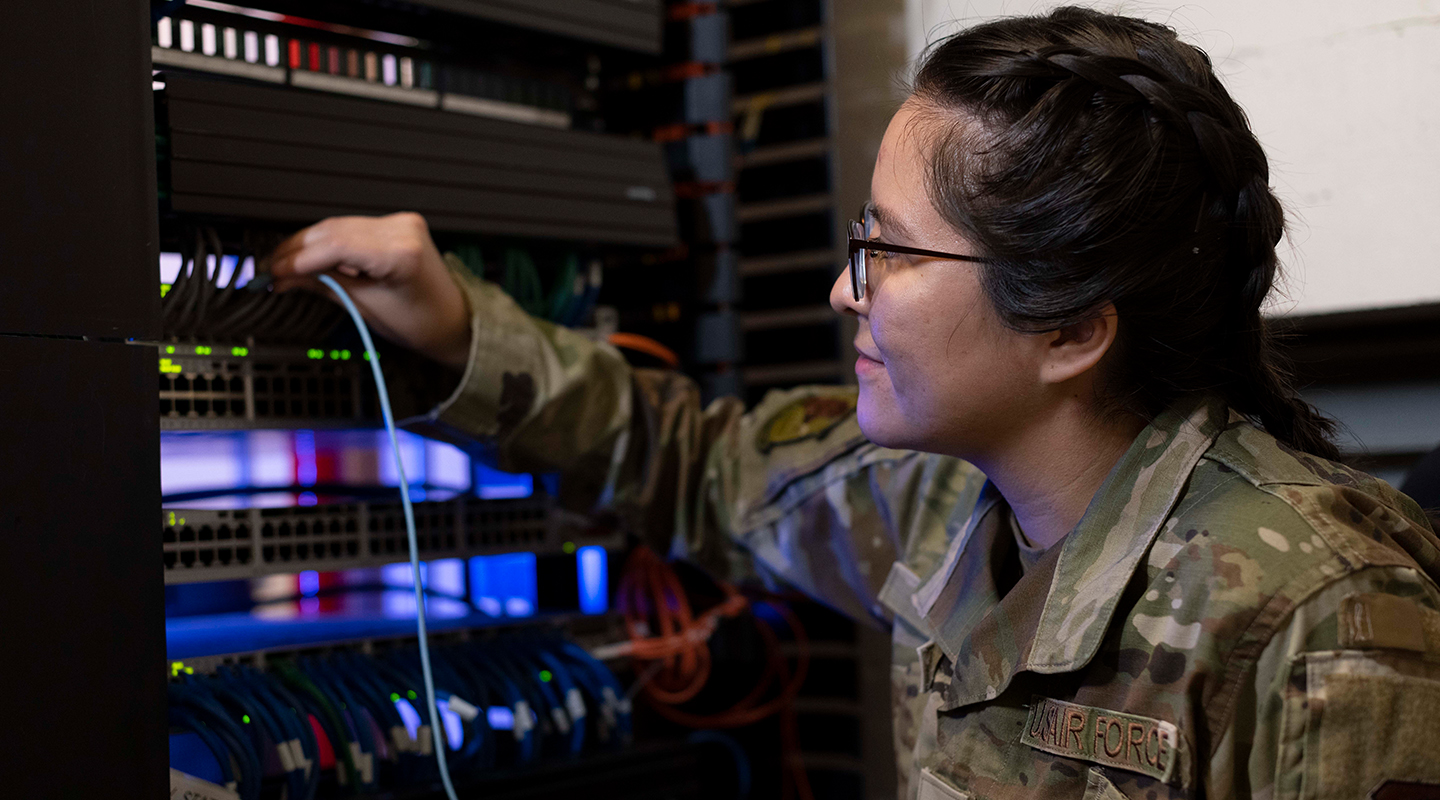 Cyber Transport Systems specialist working on a server