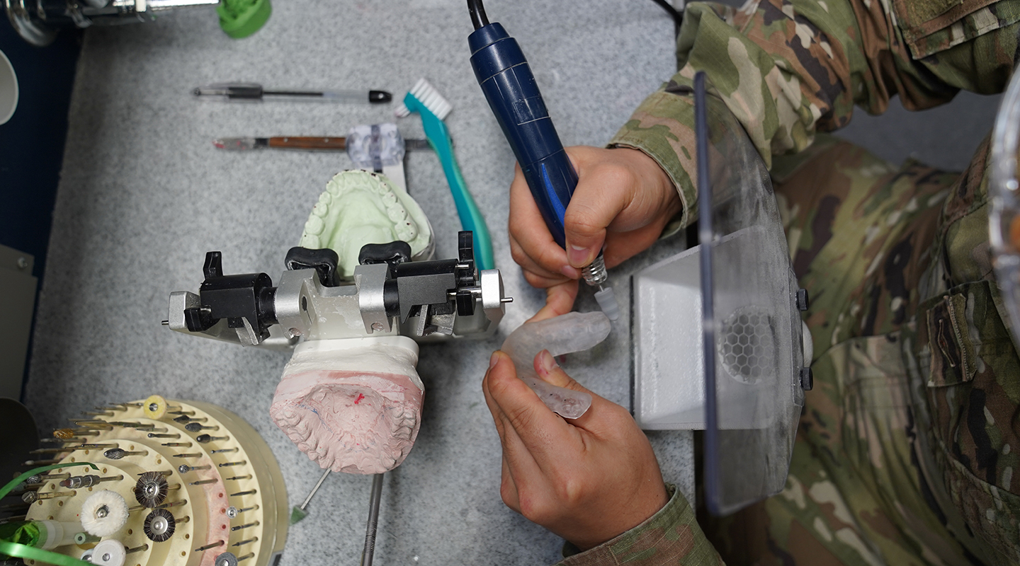 dental laboratory specialist working on a prostheses