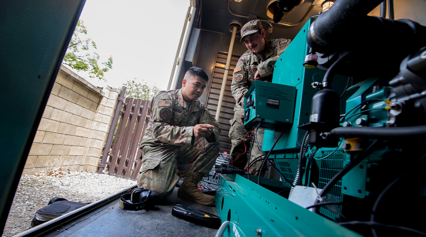 airmen working on equipment