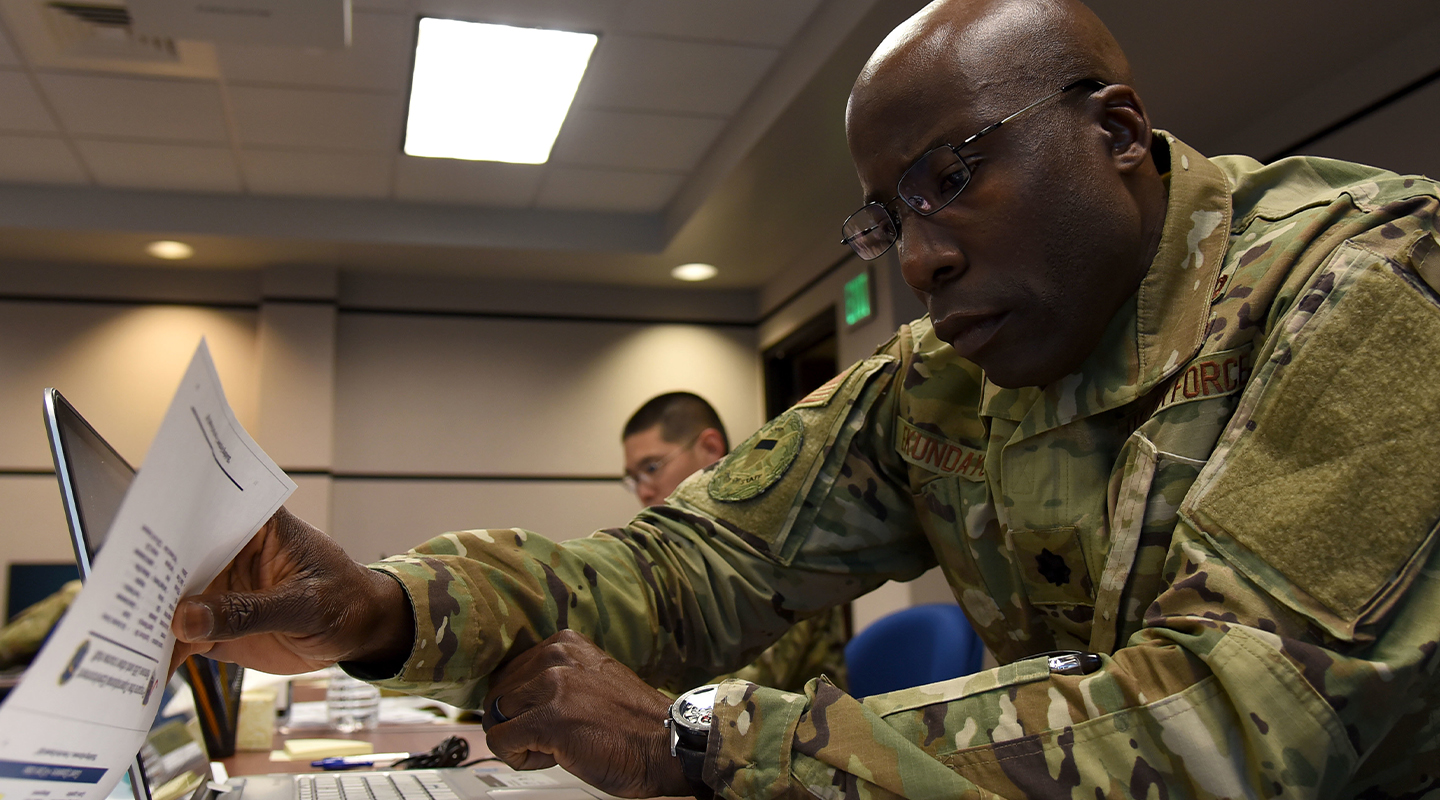 Airman looking at notepad