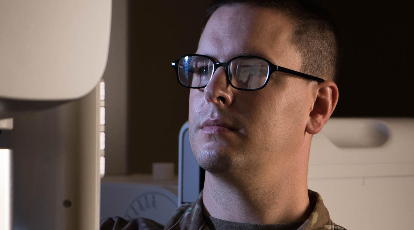 physician in front of a computer screen