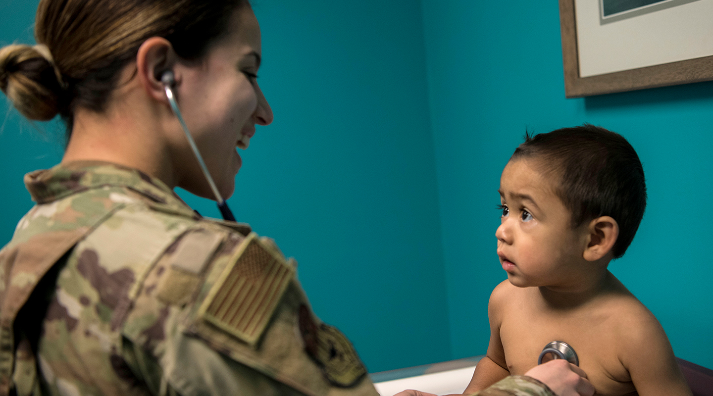 pediatrician listening to a toddler's heart