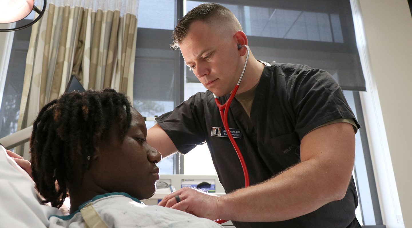 preventive medicine specialist working with patient