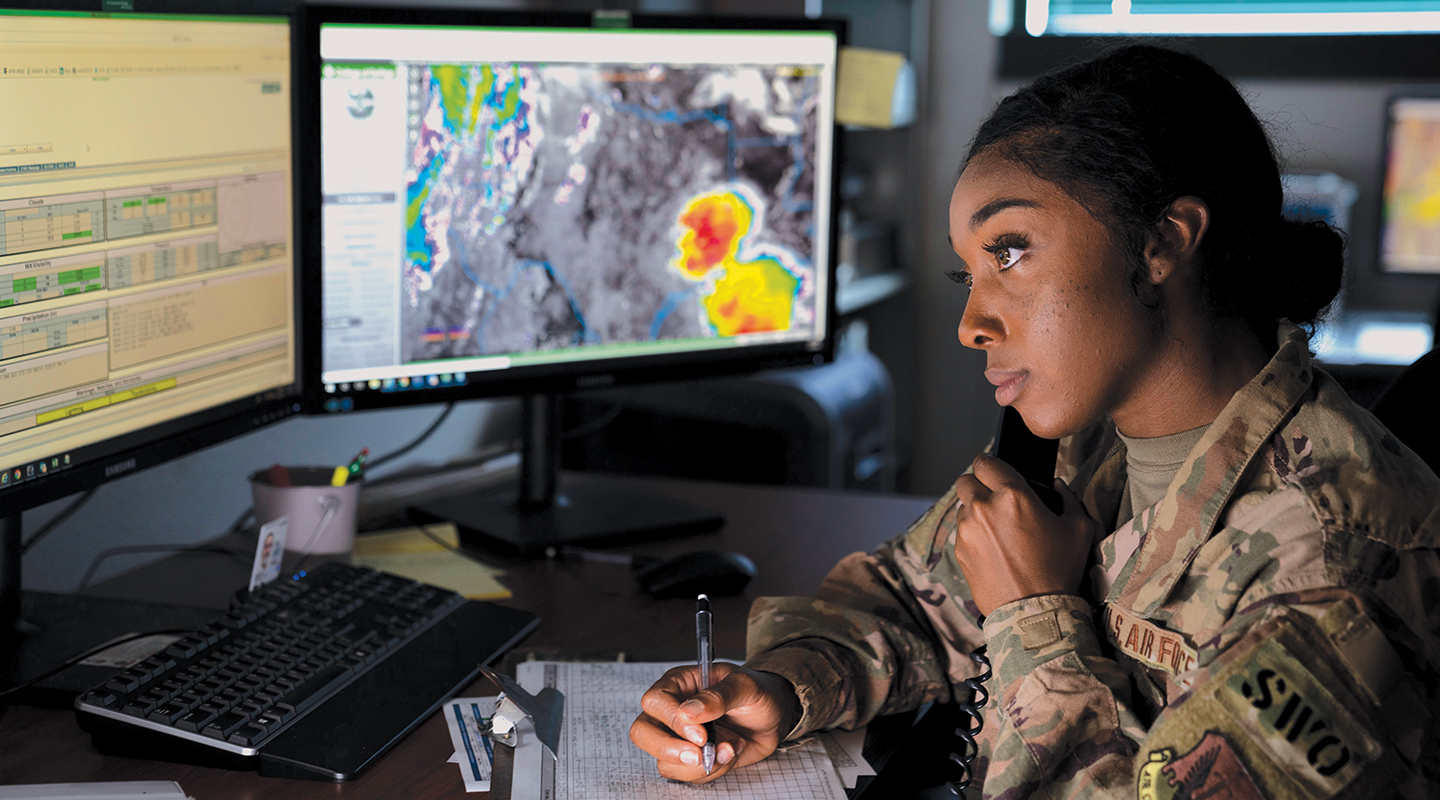 airman on phone taking notes