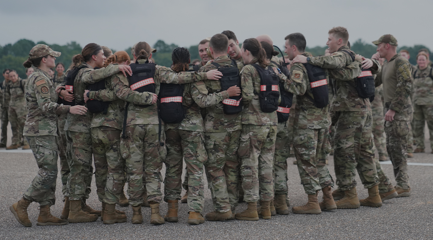 TRAINEES HUDDLE TOGETHER