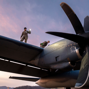 AIRMEN INSPECTING AN AIRCRAFT