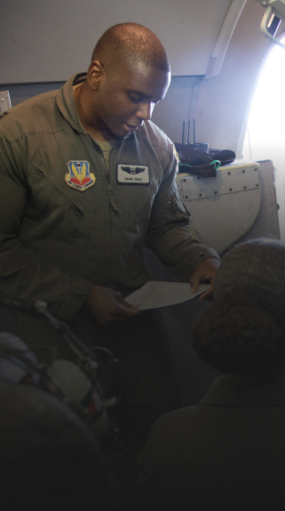 Air Battle Manager reviewing a document