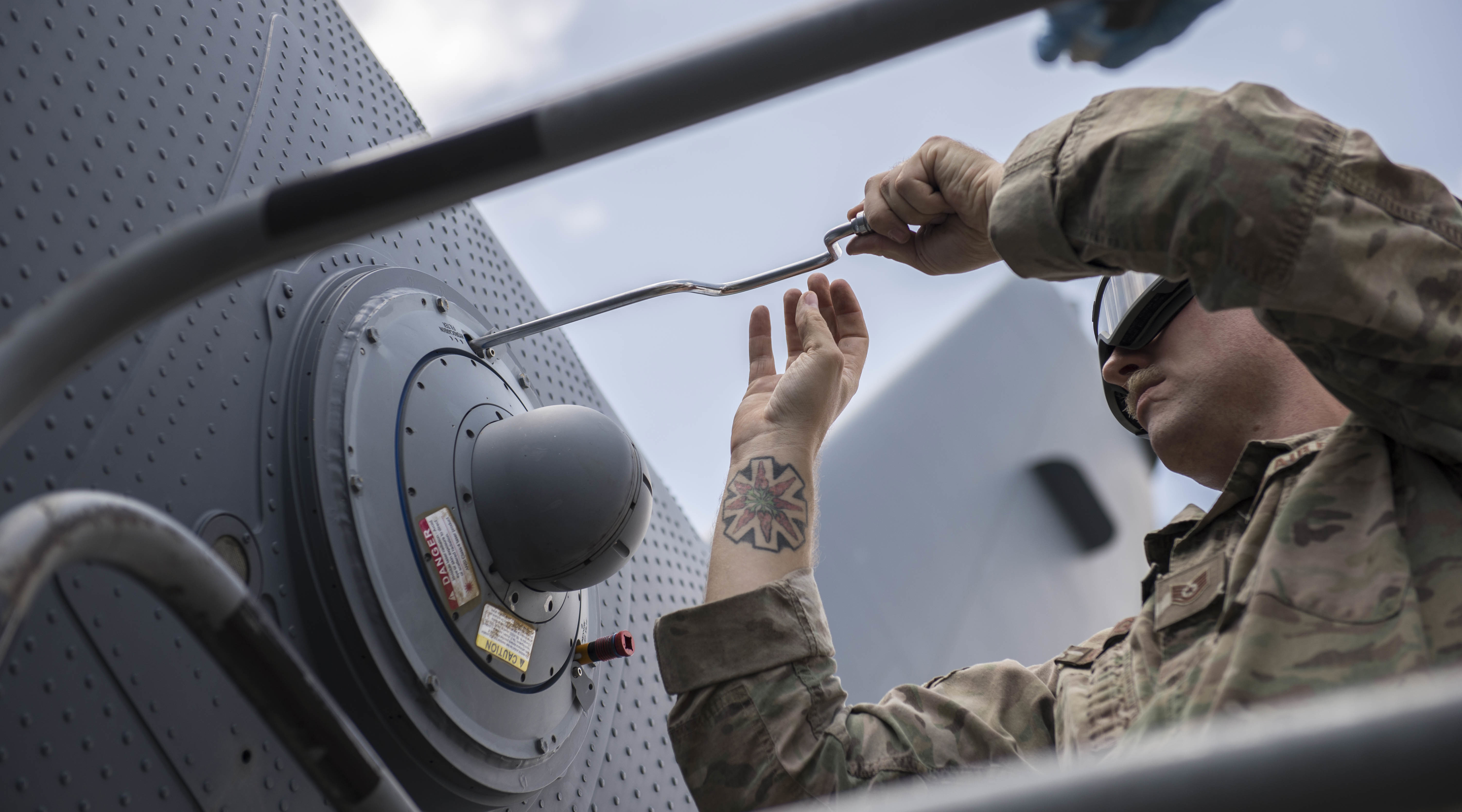 airmen working on aircraft