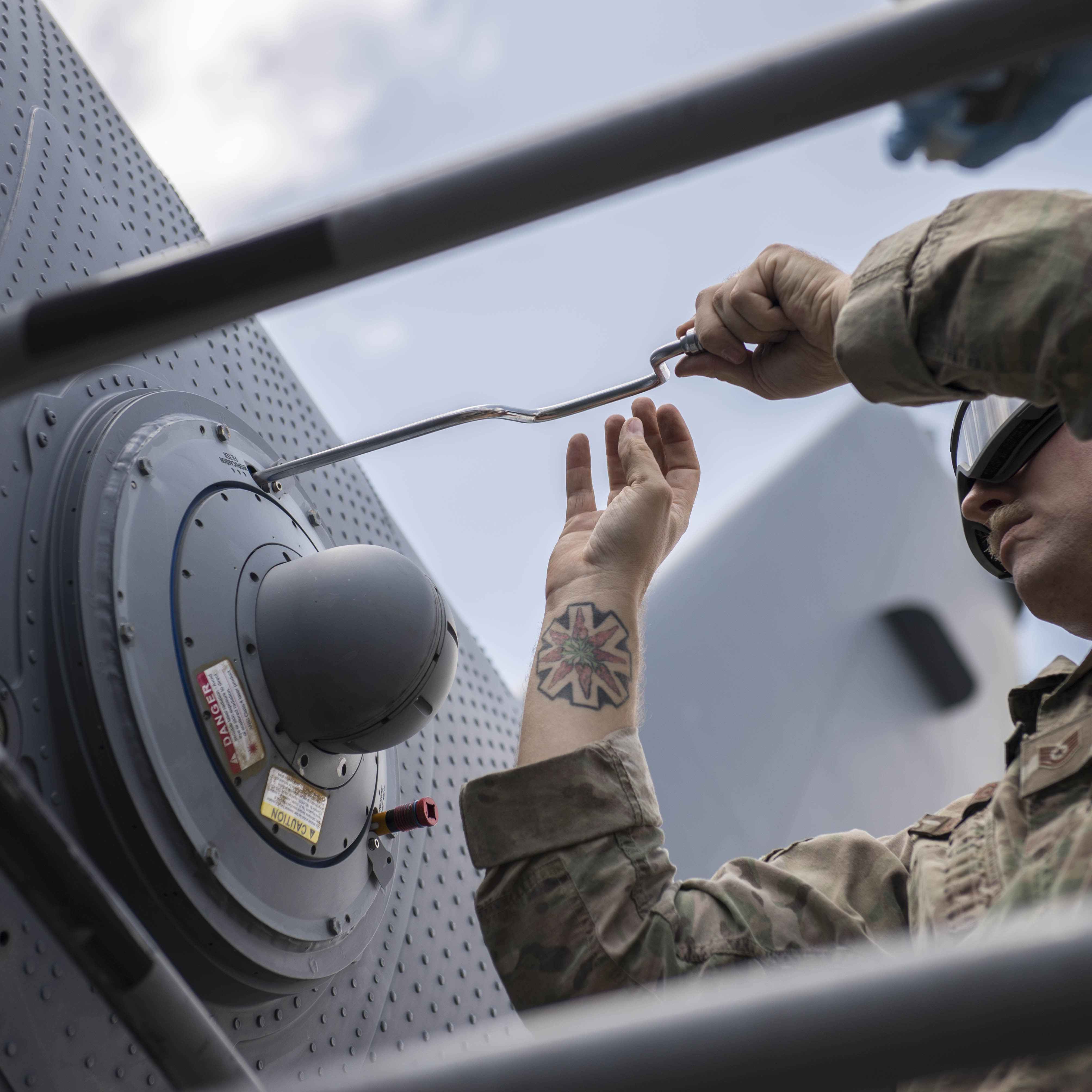 airmen working on aircraft