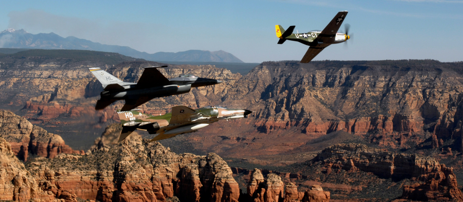 Air National Guard planes flying over canyon