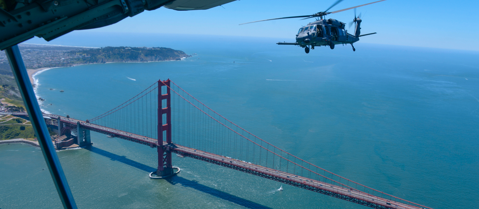 Air National Guard helicopter flying over the Golden Gate Bridge