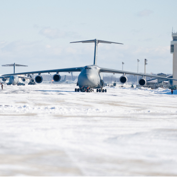 Air National Guard planes on an icy Delaware airfield