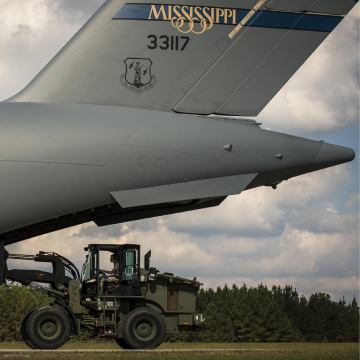 Air National Guard plane and tractor no Mississippi airfield 