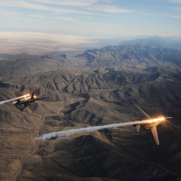 Air National Guard planes flying over canyon