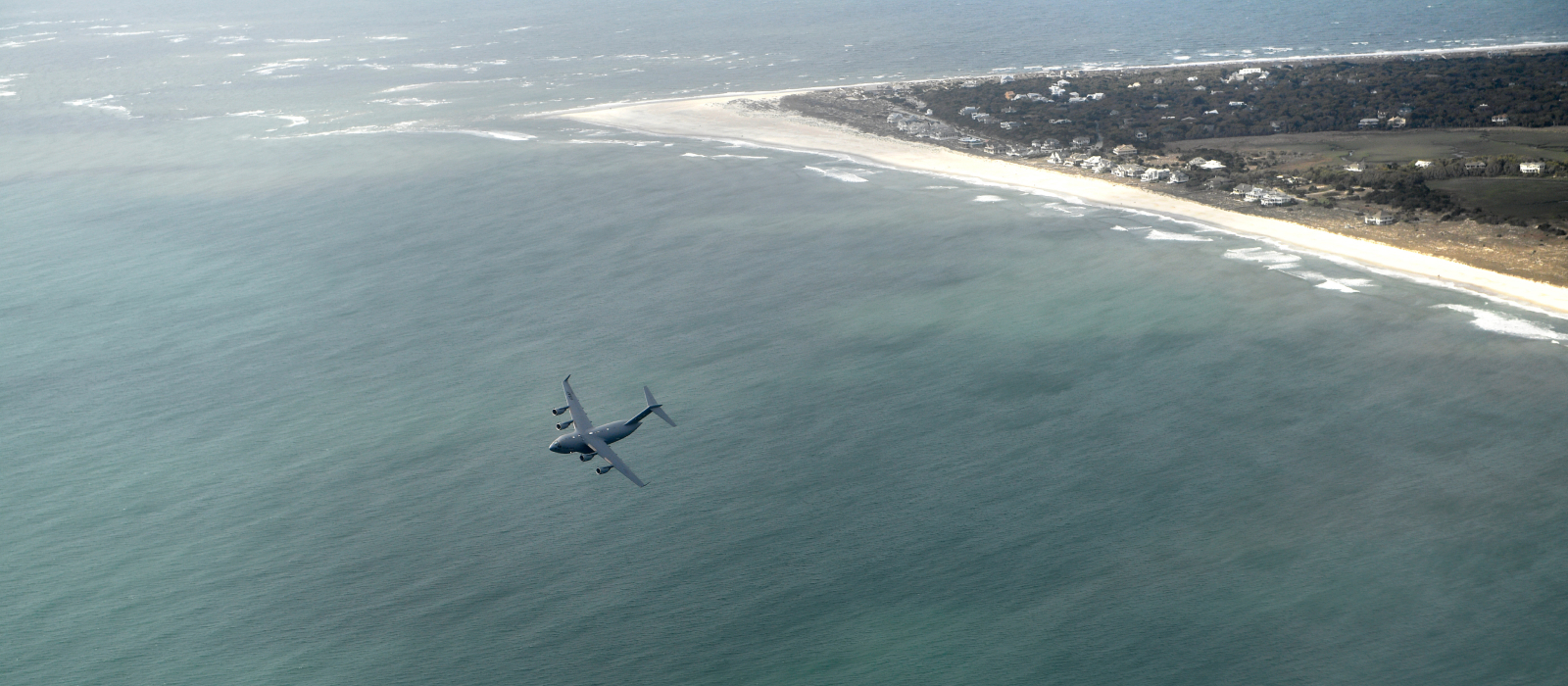 Air National Guard plane flying over North Carolina coast