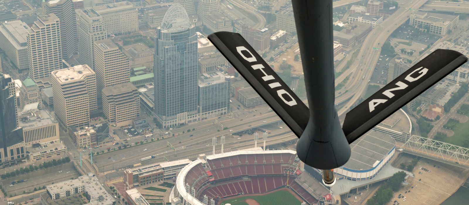 Air National Guard refueling plane flying over Ohio stadium