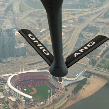 Air National Guard refueling plane flying over Ohio stadium