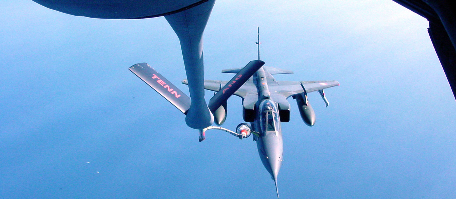 Air National Guard jet being refueled midair