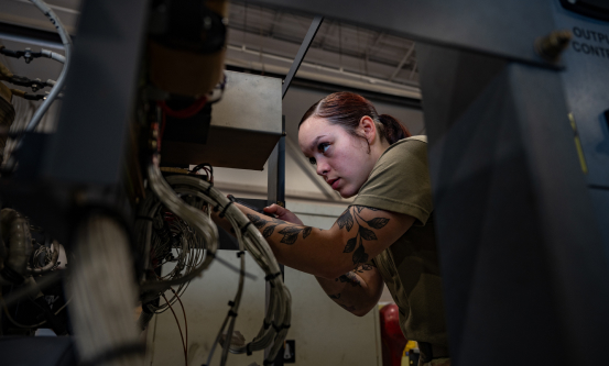 female mechanic conducting inspection