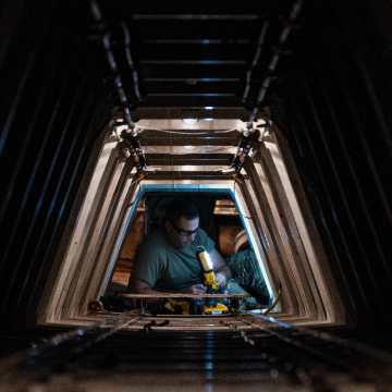 Maintainer performing maintenance checks on an aircraft